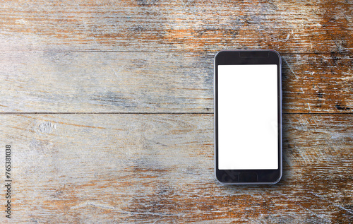 Smart phone on old wooden background