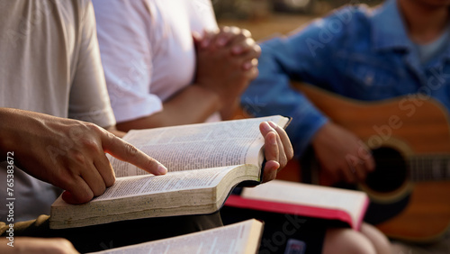 The people read and studied the bible at the park and prayed together. sharing the gospel with a friend. The concept of studying the Bible . on Sunday.Studying the Word Of God With Friends. Education.
