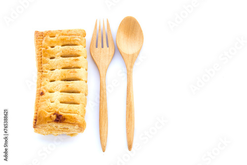 Pineapple pie and wooden spoon on white background