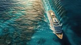 Aerial shot of a luxury cruise ship sailing on the shimmering ocean with sunlight reflections.
