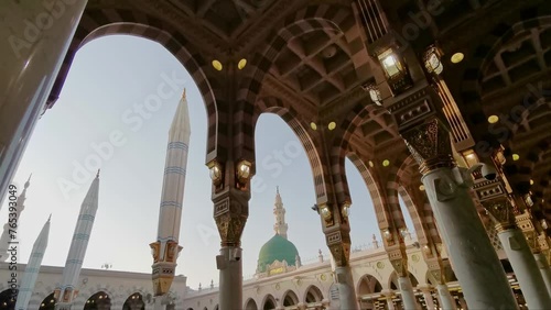 Static general view green dome and Moorish pattern arches of Nabawi mosque in Al Madinah, Saudi Arabia. 