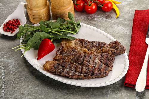 Grilled chuck roll steak with arugula © Andrei Starostin