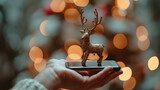 mobile device in a hand with a reindeer antler for Christmas