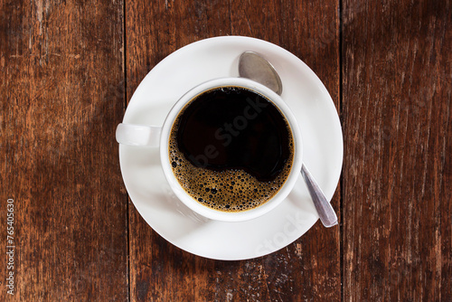 Coffee cup on dark wooden table