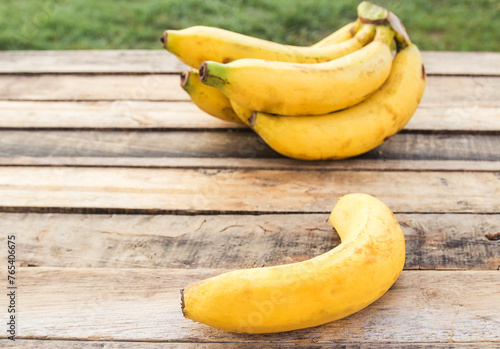 Fresh bananas on a wooden table