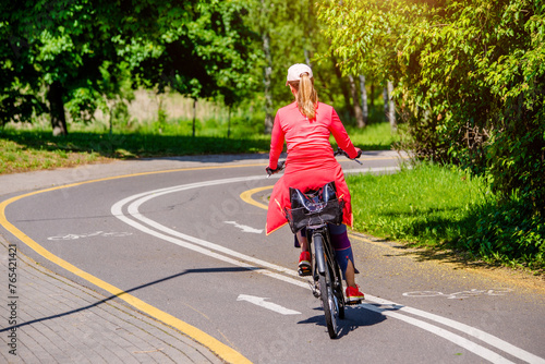 Wallpaper Mural Cyclist ride on the bike path in the city Park
 Torontodigital.ca
