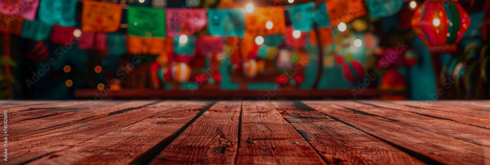 An empty old wooden table with festive decor and Mexican holiday lighting in soft focus in the background. A festive banner with more space for text or product. - obrazy, fototapety, plakaty 