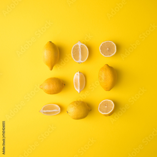 Creative Pattern concept Flat lay minimal layout made from sliced lemon on yellow background.