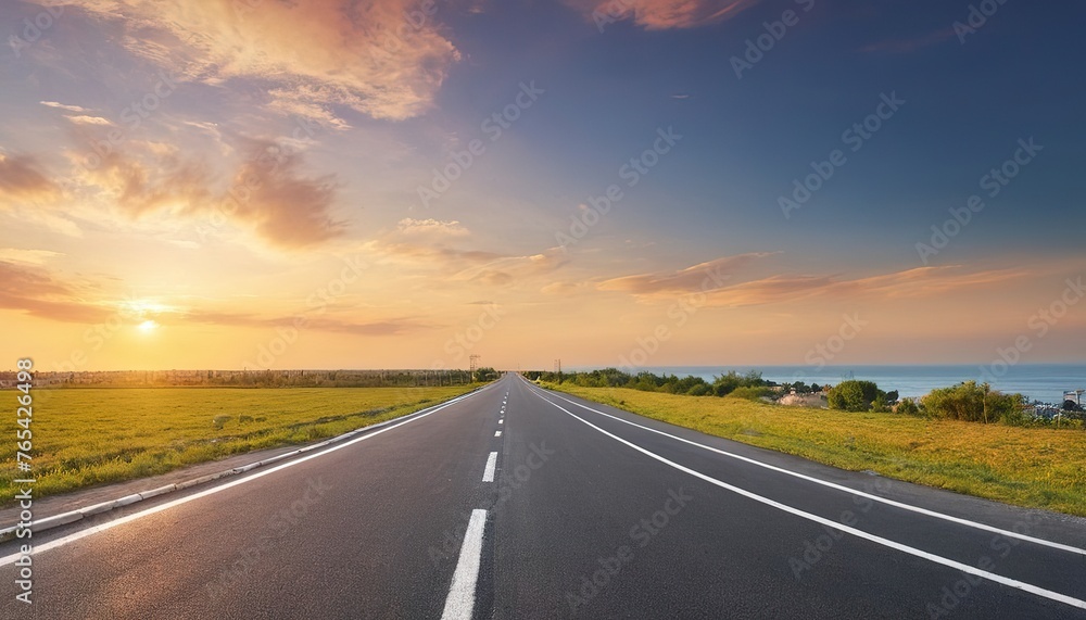 panoramic view of nice summer empty road on sunset