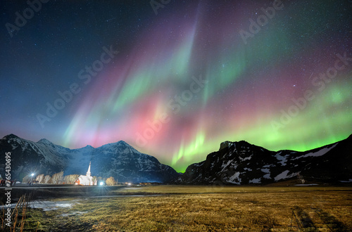 A lot of colorful of Aurora borealis. with a red church ,Flankstad, on Norway 
