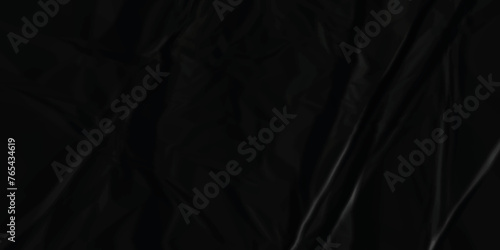 Dark black crumpled paper texture background. black crumpled and top view textures can be used for background of text or any contents. 