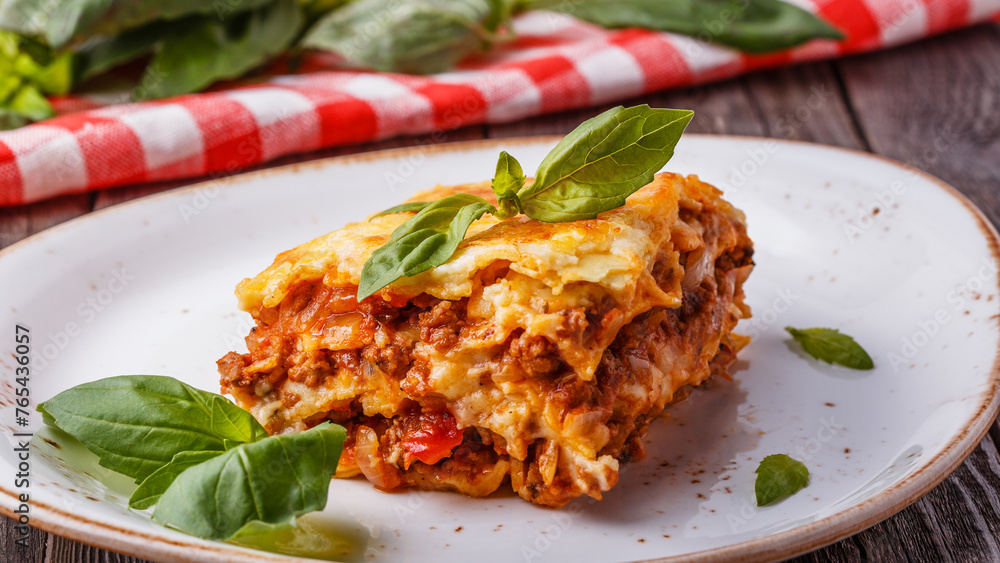 Traditional lasagna made with minced beef bolognese sauce - obrazy, fototapety, plakaty 