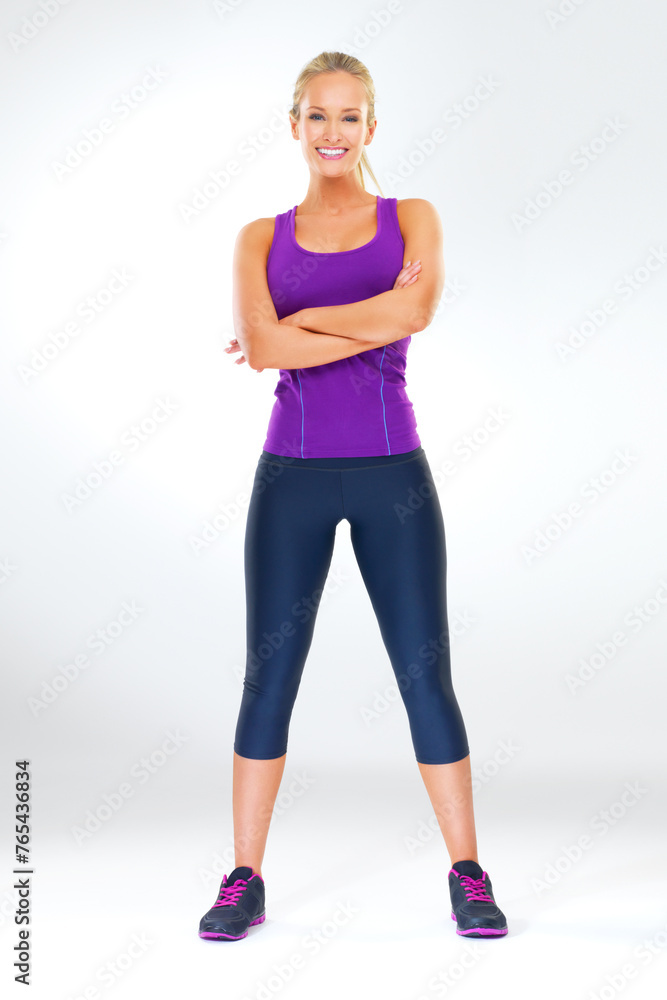 Woman, portrait and arms crossed for fitness in studio with happiness, confidence or ready to exercise. Athlete, person and smile with sportswear for training, workout or wellness on white background Woman, portrait and arms crossed for fitness in studio with happiness, confidence or ready to exercise. Athlete, person and smile with sportswear for training, workout or wellness on white background