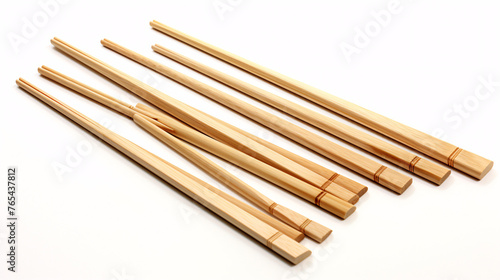 Wooden chopsticks isolated on white background. Close-up.