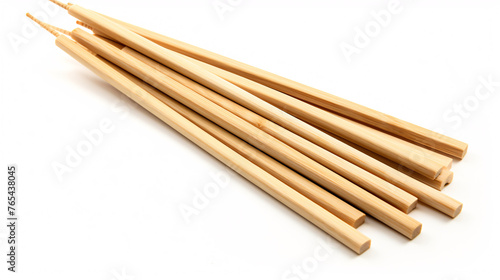 Wooden chopsticks isolated on white background. Close up. Selective focus.