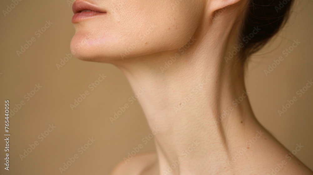 Sensitive female body on a beige background highlighting the elegance and sensitivity of the female form. Women's neck and shoulders Sensitive female body on a beige background highlighting the elegance and sensitivity of the female form. Women's neck and shoulders