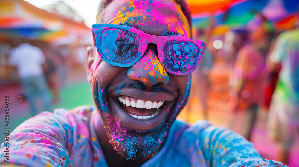 Cheerful man at the festival of colors Holi Cheerful man at the festival of colors Holi