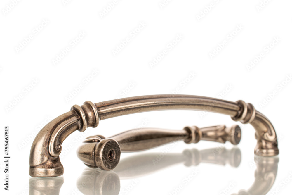 Two metal handles for furniture, macro, isolated on white background. Two metal handles for furniture, macro, isolated on white background.