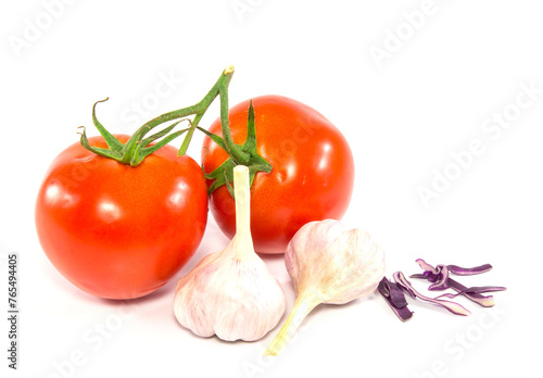 Fresh red tomato and garlic on white background