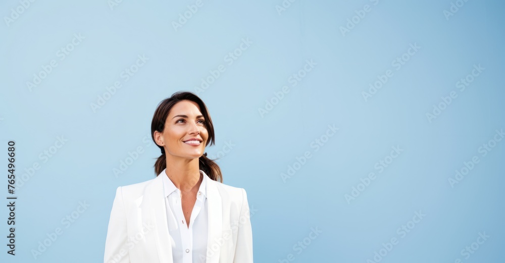 A professional portrait of a joyful businesswoman exuding confidence, dressed in a stylish suit, and looking directly into the camera A professional portrait of a joyful businesswoman exuding confidence, dressed in a stylish suit, and looking directly into the camera