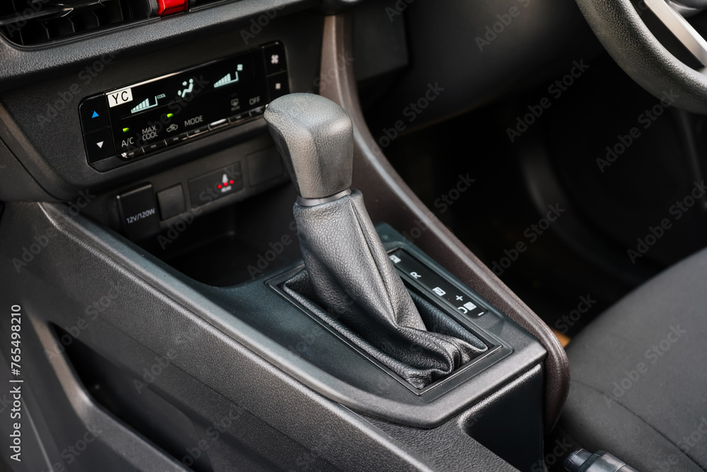 automatic transmission shift selector in the car interior. Closeup a manual shift of modern car gear shifter. 4x4 gear shift	
