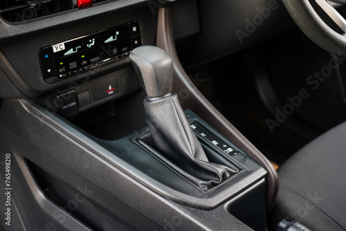 automatic transmission shift selector in the car interior. Closeup a manual shift of modern car gear shifter. 4x4 gear shift   © Muanpare