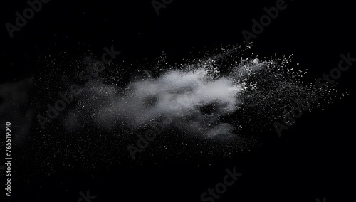 Freeze motion of white dust particles splash on black background.White powder explosion clouds.