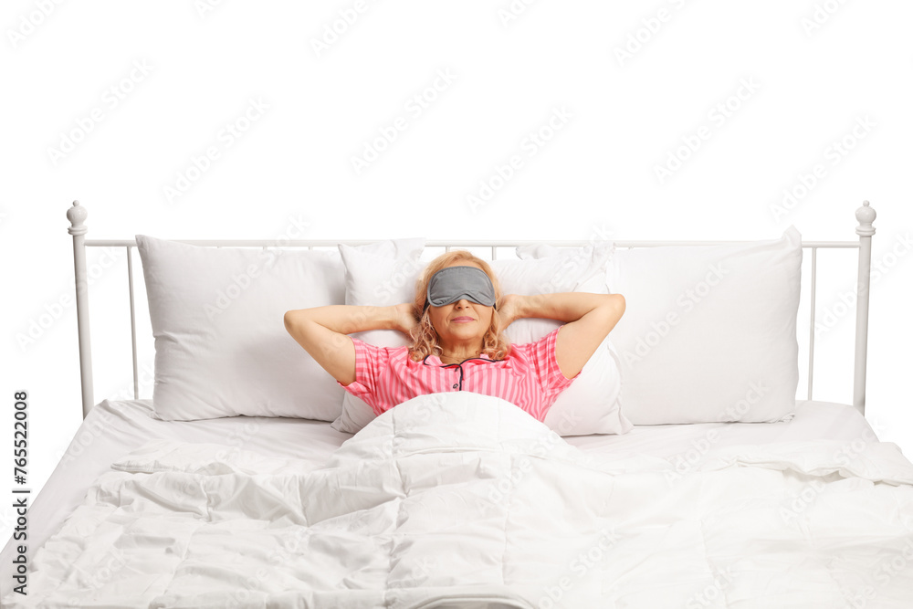 Woman resting in a bed with mask over eyes Woman resting in a bed with mask over eyes
