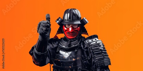A man in a samurai suit standing confidently on orange background giving thumbs up. Modern and traditional concept