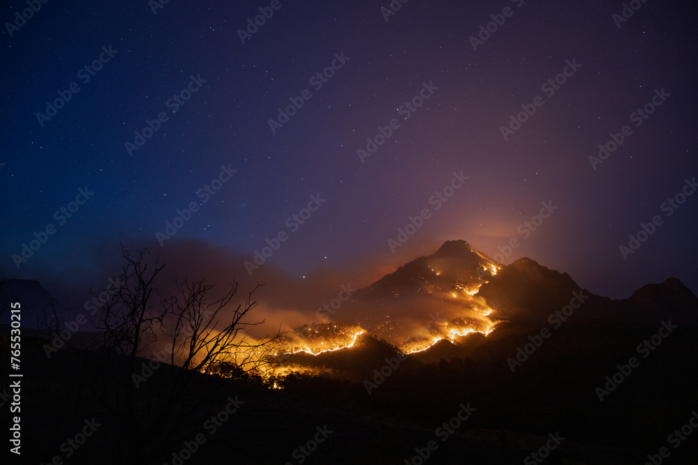 Mt Barney glowing with a line of fire over it Mt Barney glowing with a line of fire over it