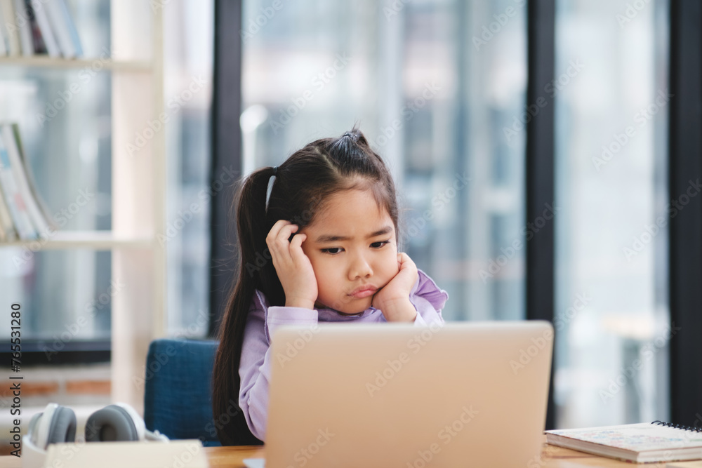 Young Girl Bored with Online Learning. Young Girl Bored with Online Learning.