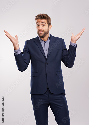 Konstfotografi Man, fashion and portrait for shrug and clueless with tuxedo or suit and isolated for puzzled, uncertain and confused