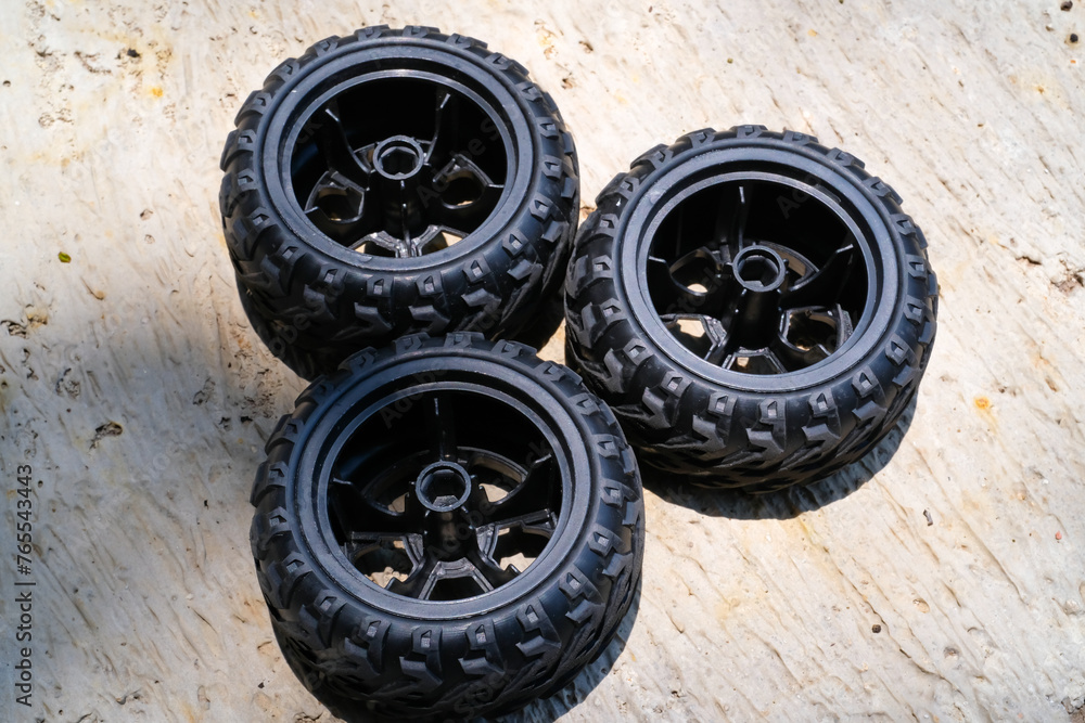 New toy car rubber tires. Three pieces of RC (Remote Control) Car tires. Toys Photography. Hobbies and leisure. Selective Focus. Textured Details. Shot in Macro lens