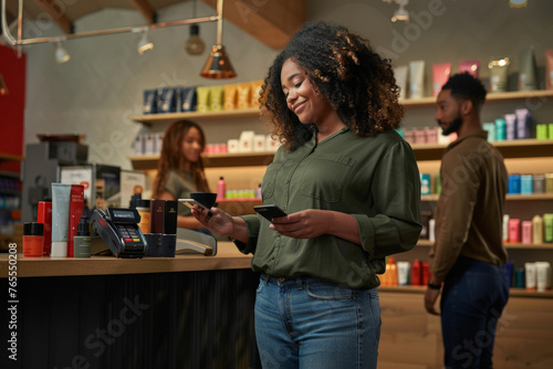 Attractive Plus Size African American Woman Making Contactless Payment at Counter
