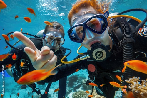 two people scuba diving in coral reef © PNG Lab