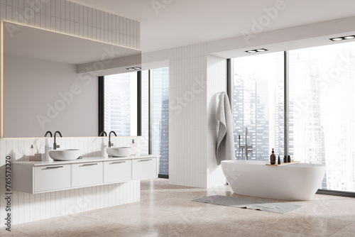 Modern home bathroom interior with bathtub  double sink and panoramic window