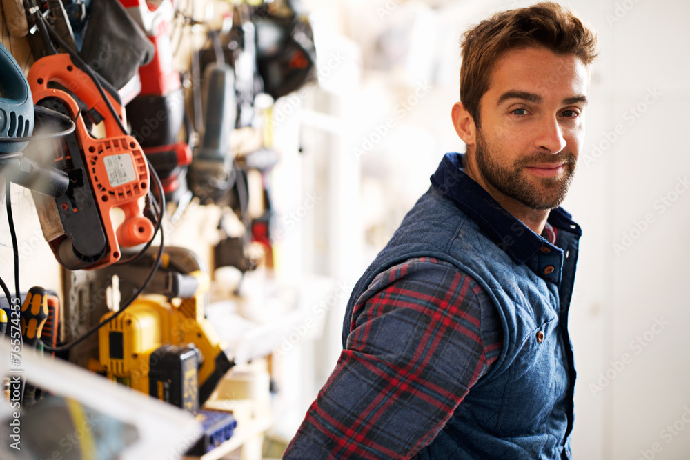 Tools, carpenter and portrait of man in garage for manufacturing, production or small business. Male person, equipment and handyman with smile for renovation, maintenance or remodeling in workshop Tools, carpenter and portrait of man in garage for manufacturing, production or small business. Male person, equipment and handyman with smile for renovation, maintenance or remodeling in workshop