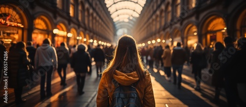 blurred portrait of crowd of people walking on street photo