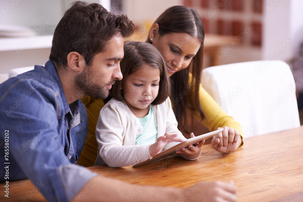 Mother, father and child at table with tablet for teaching, learning or support in education. Elearning, digital app and parents with girl for help in homeschool, growth or development in online game Mother, father and child at table with tablet for teaching, learning or support in education. Elearning, digital app and parents with girl for help in homeschool, growth or development in online game