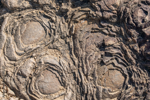 Spheroidal weathering tholeiitic basalt.   onion skin weathering, concentric weathering, spherical weathering, or woolsack weathering. Ka'iwa Ridge (Lanikai Pillbox) Trail Oahu Hawaii Geology
 photo