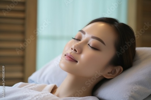 Woman Laying in Bed With Eyes Closed