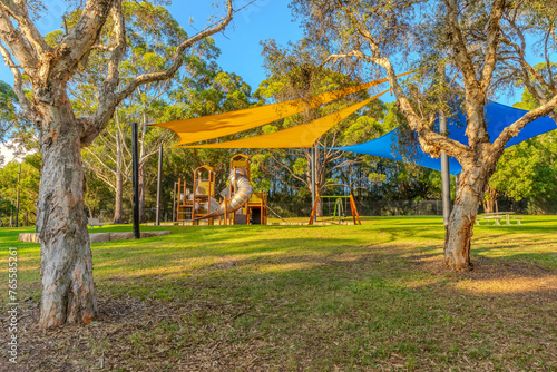 Photography colourful Kids park with swings and slides yellow and blue shades in Suburban we