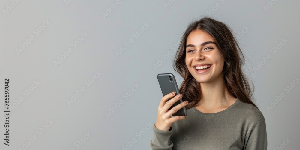 Smiling business woman talking on the phone Horizontal banner on the studio wall Smiling business woman talking on the phone Horizontal banner on the studio wall