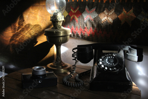 old fashioned phone with lamp and vintage camera (ID: 765605291)
