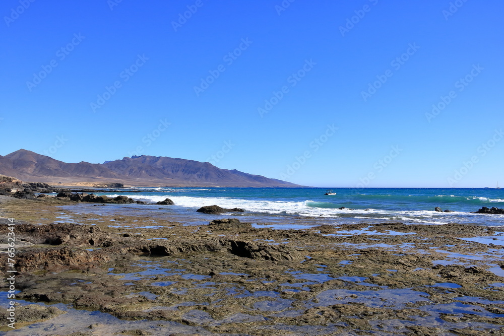 peninsula Jandia at Fuerteventura and the sea near Puerto de la Cruz village at Canary Islands peninsula Jandia at Fuerteventura and the sea near Puerto de la Cruz village at Canary Islands