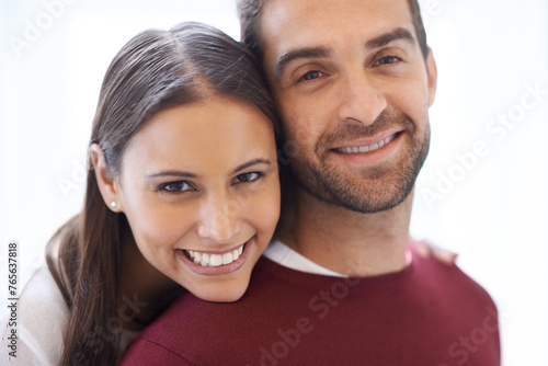 Portrait, hug and happy couple in a house with love, trust and security, support or bonding at home. Marriage, commitment or face of people in embrace in comfort, safety or gratitude in an apartment