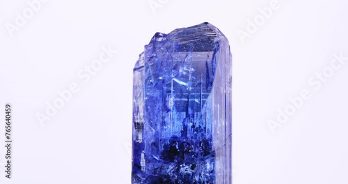gemmy tanzanite (blue violet zoisite) macro 360° 4k footage on white background