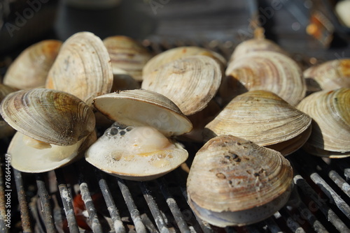 Fresh clams are grilled on a brazier and eaten.