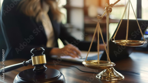 Legal professional workspace featuring scales of justice, gavel, and laptop