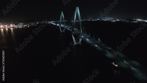 Aerial Backward Scenic View Of Famous Cable-Stayed Bridge Over Cooper River Against Clear Sky At Night - Charleston, South Carolina photo